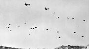 German paratroopers jumping From Ju 52s over Crete