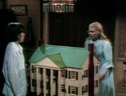 David and Hallie in Playroom looking at Rose Cottage