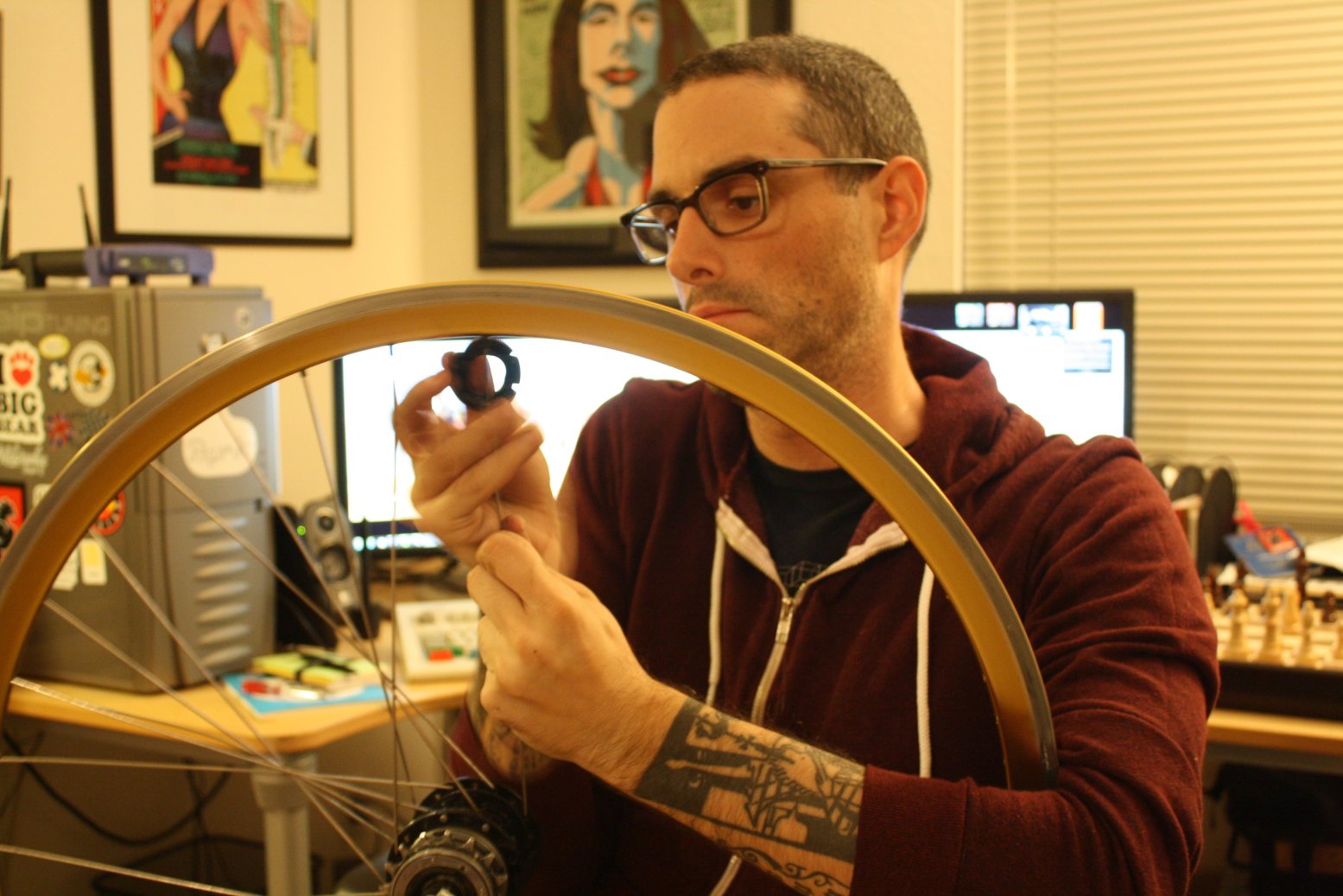 Josh_Sawyer_removing_spokes_from_a_bicycle_wheel.jpg