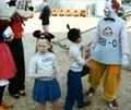 Disney characters with clown and mouseketeers